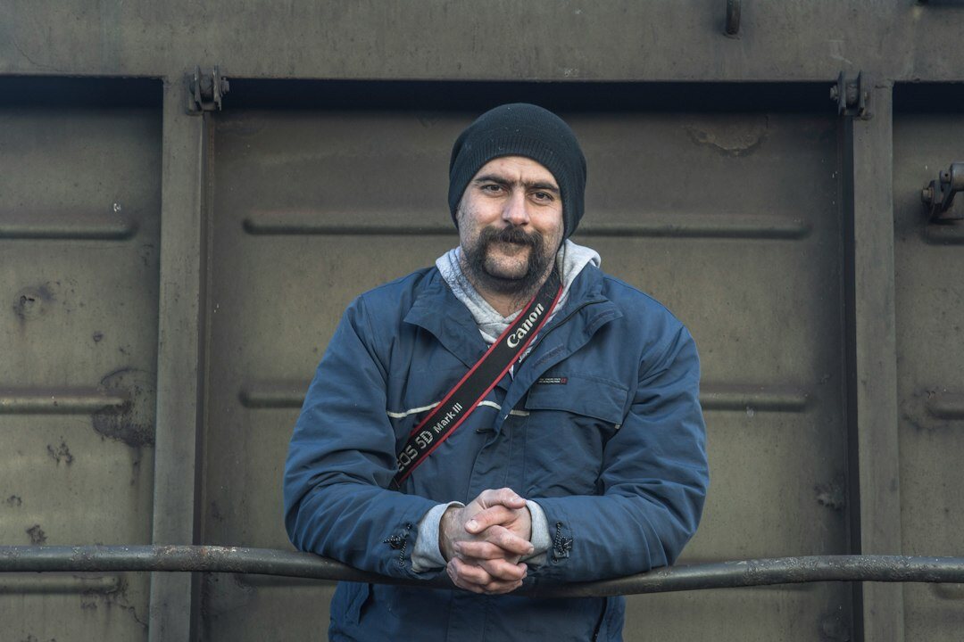 Portrait of a European man film director with a beard