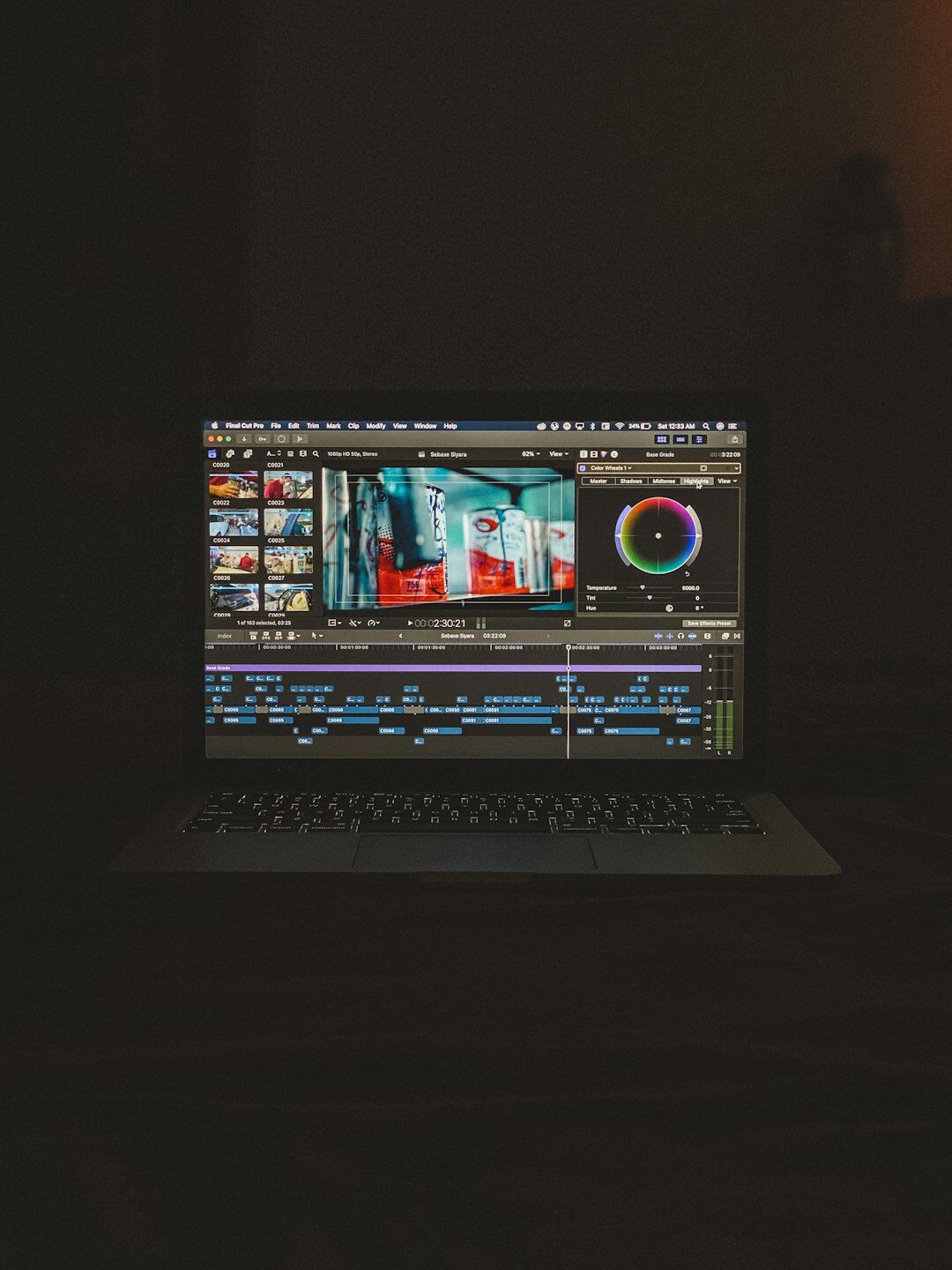 video editor adjusting colors on computer